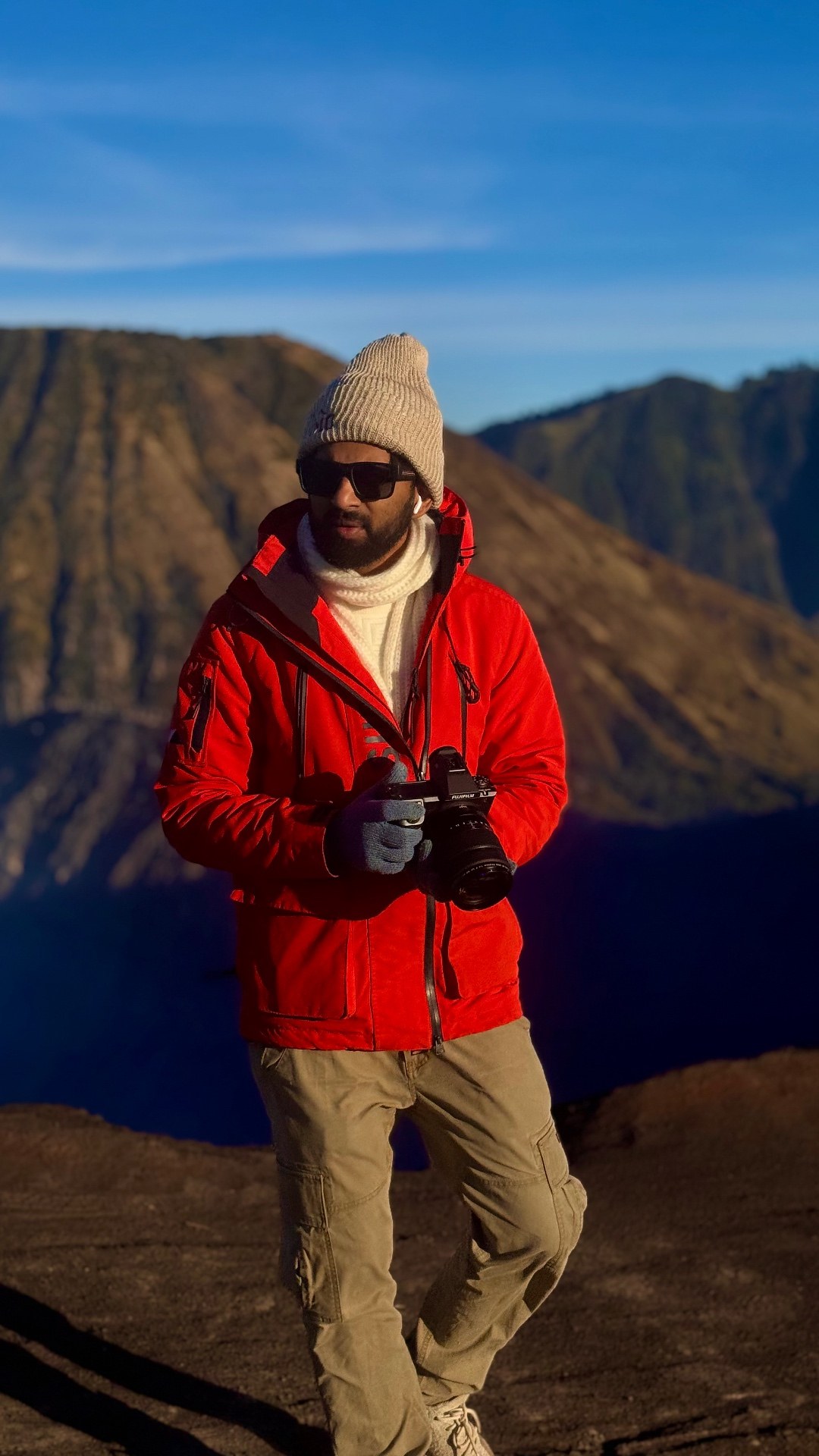 Sairam RSNV, wildlife photographer and founder of Faunterra, on a ridge at first light with his camera